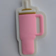 A pink silicone bottle-shaped mold or cutter with a white backing, shown on a plain white surface.